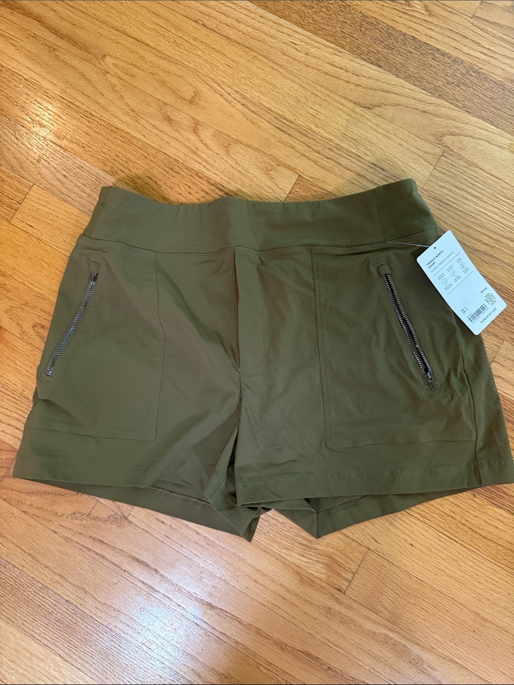Athleta Olive Green Trekkie Shorts with Zip Pockets